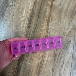 Daily pill organizer sorter container